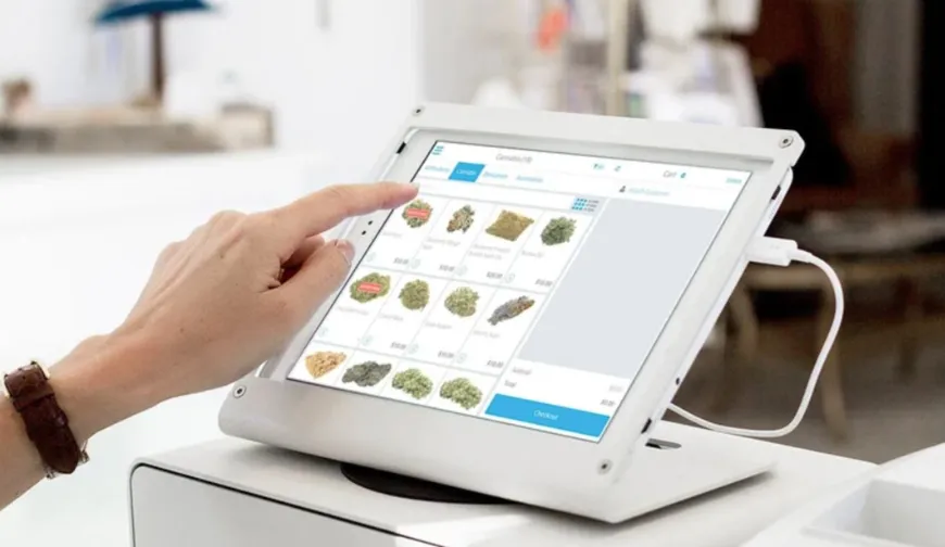 Finger touching tablet screen with products displayed; point of sale system in modern retail environment.